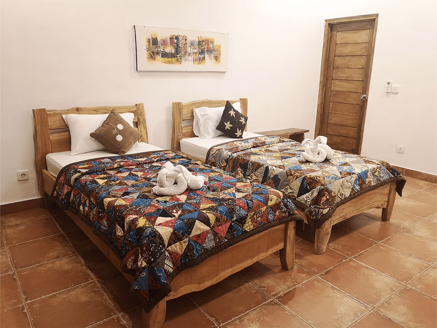 Deluxe Twin Room at Bali Dive Resort featuring double beds.