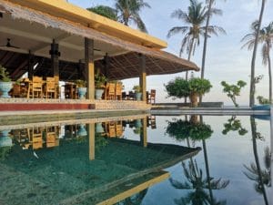 pebble & fins bali diving resort and spa dive pool with restaurant view
