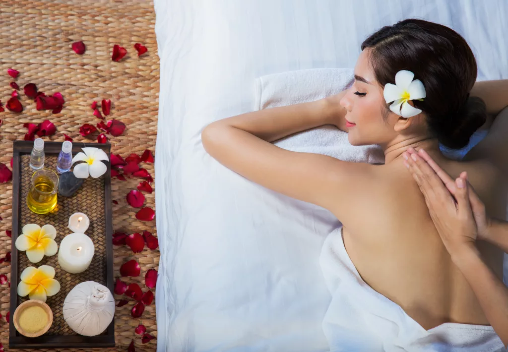 The girl relaxes in the spa salon with hand massage - Bali Dive Resort