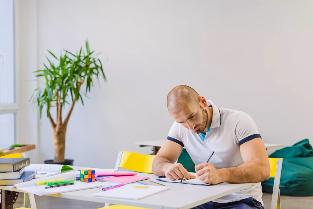 a man sitting and studying about scuba diving