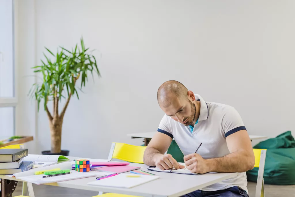 a man sitting and studying about scuba diving