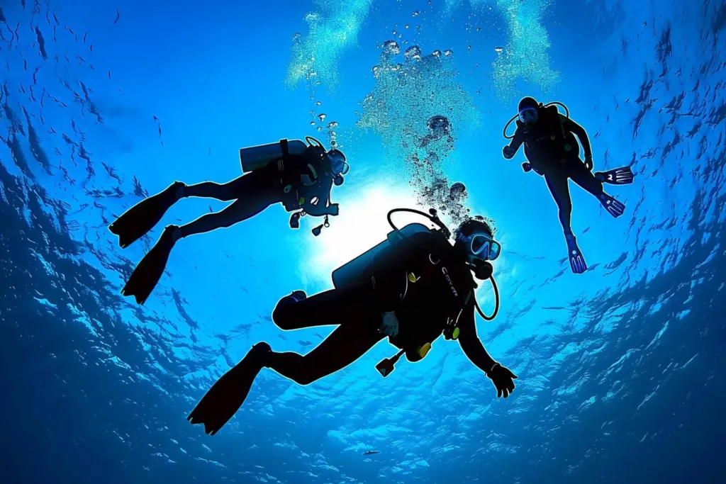 scuba diving together in the clear visibility - boga wreck