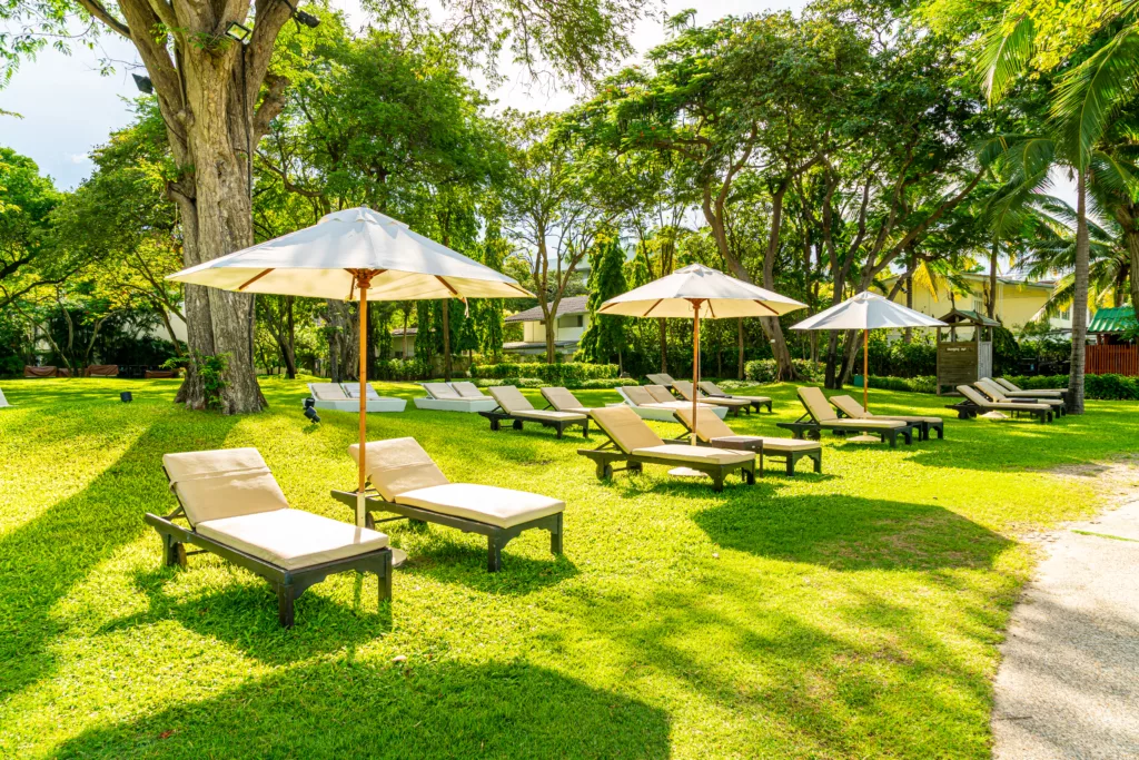 Umbrella and chair in garden for sun bathing or relax - bali dive resort