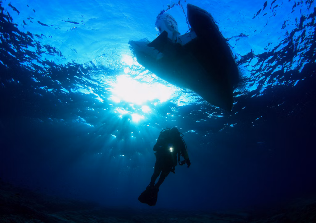 Local divers exploring ocean depths through Bali diving courses.